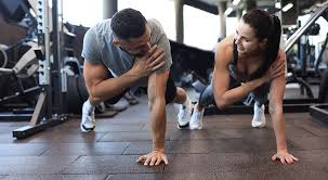 Toning Bingo Wings: Your Ultimate Guide to Sculpting Sleek Arms at the Gym 3 Fitness trainer demonstrating arm toning exercises Rugby