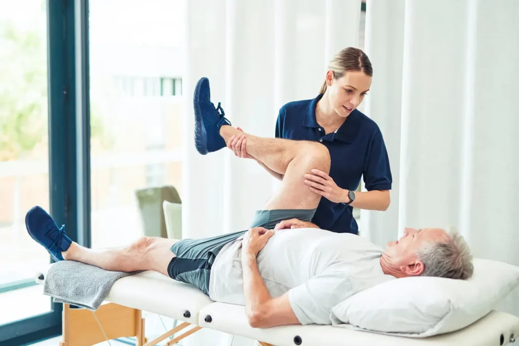 Revitalising Recovery: Effective Rehabilitation Strategies for Muscle Injuries 3 Physiotherapist assisting a patient with muscle recovery exercises Rugby