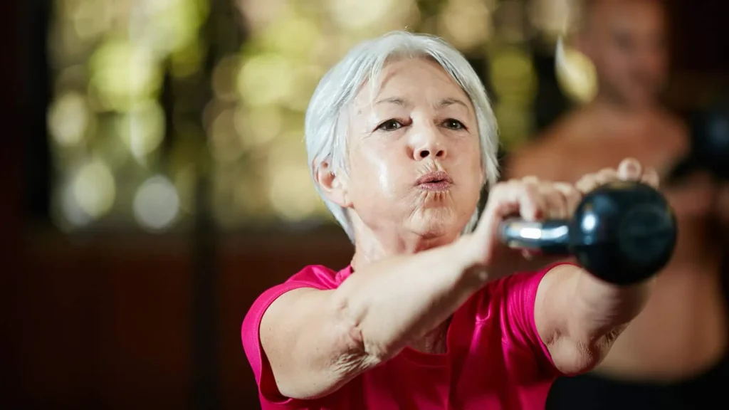 Toning Bingo Wings: Effective Exercises and Tips for Achieving Sleeker Arms 2 Person performing arm exercises with dumbbells Rugby