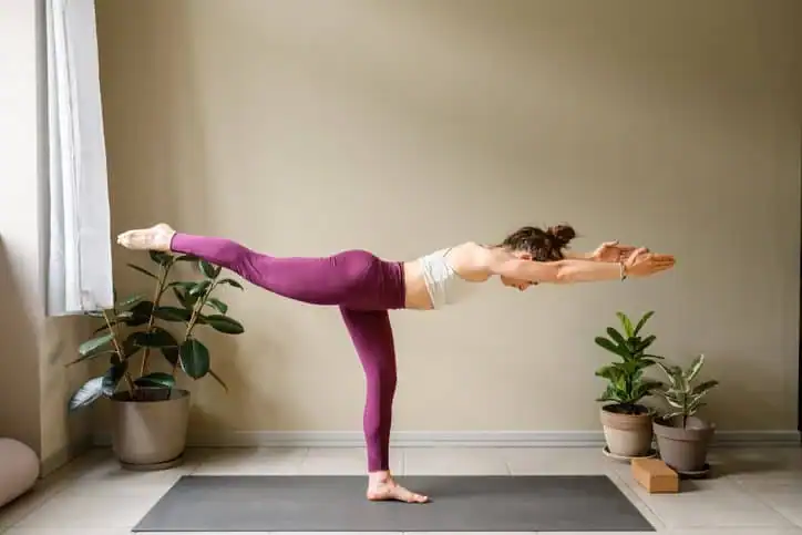 Achieving the Perfect Tone: How Often Should You Exercise for Results? 1 Woman doing Yoga exercise Rugby to help with toning the body.