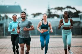 Sculpting Sleek Arms: The Essential Role of Cardio in Toning Without Bulking Up 3 image of people running to incorporate cardio Rugby exercise into their life to help tone arms and body.